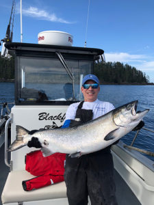 Captain Gary Lachman holding his 36 lb. Tyee Chinook Salmon
