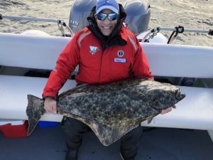 Captain Gary Lachman with a 55 lb. Halibut