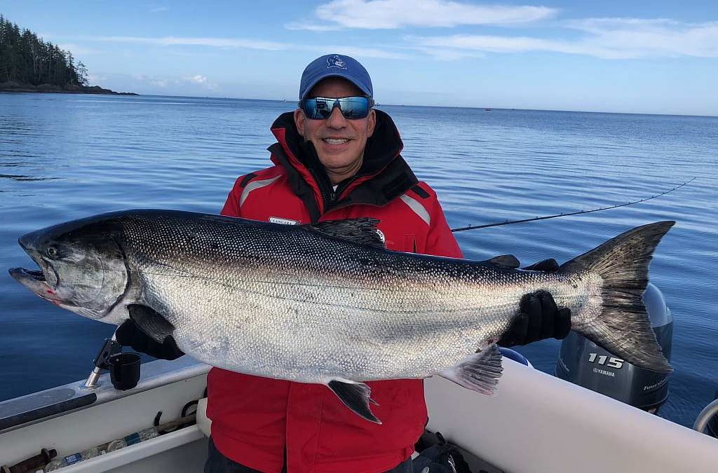 Captain Gary Lachman holding his 31 lb. Tyee Chinook Salmon