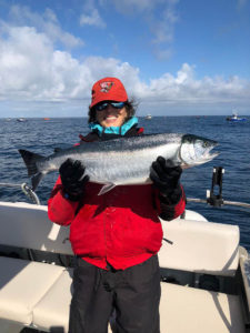 Linda Fellner holding her 15 lb. Coho Salmon