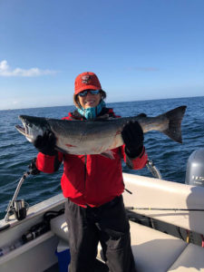 Linda Fellner holding her 28 lb. Chinook Salmon